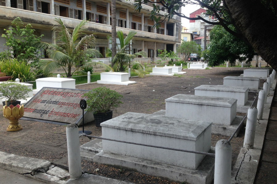 The 14 graves belonging to the people the Khmer Rouge slaughtered and left behind when they fled Tuol Sleng Prison