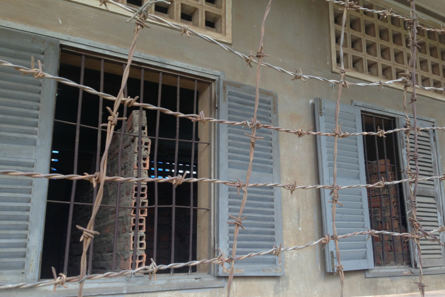 Barbed wire enclosing the halls of Tuol Sleng Prison in Phnom Penh