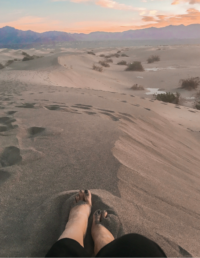 Feet in the sand at Mesquite Sand Dunes for sunrise