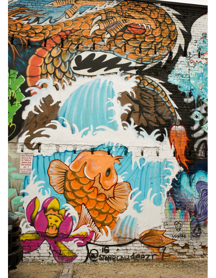 Freak Alley Street Art: A dragon, a koi, and a raging wave