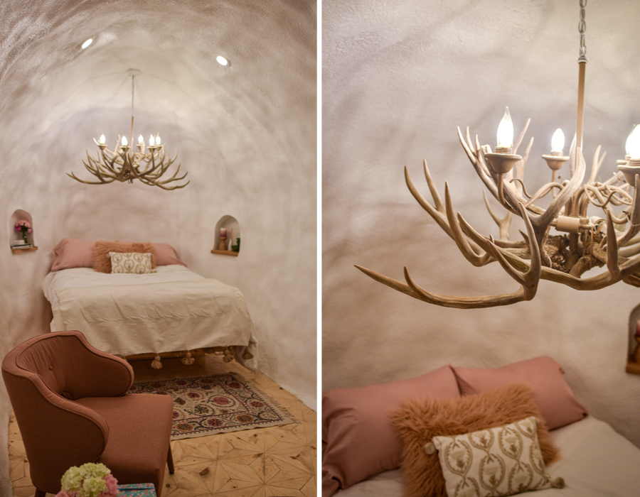 The bed and the antler chandelier inside the Big Idaho Potato hotel