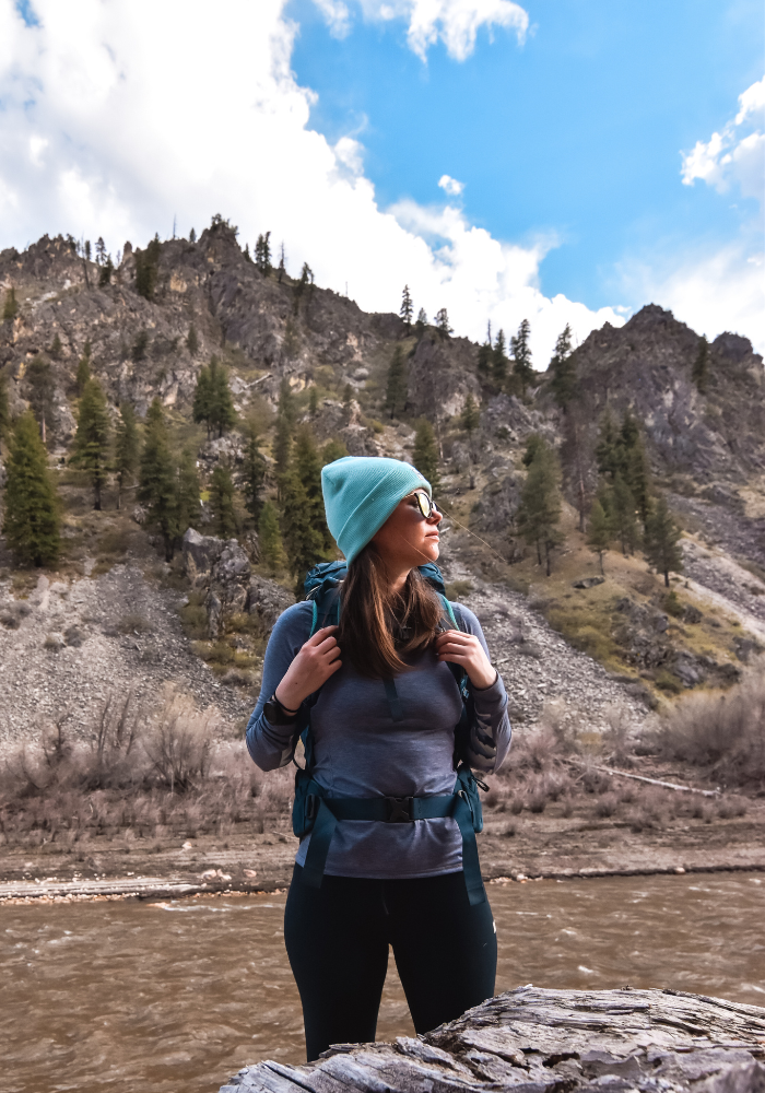 Gazing out while backpacking near a river in Idaho